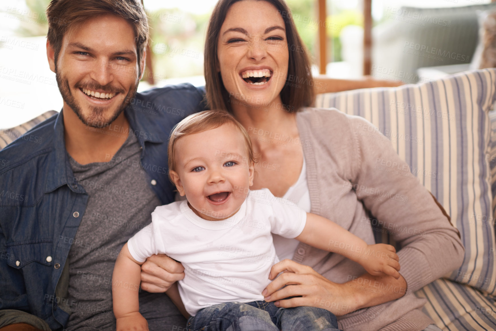 Buy stock photo Laughing, happy family or portrait of baby on sofa in home for support, security or bonding in living room. Parents, boy or toddler with mom or father for love or care for child development or growth