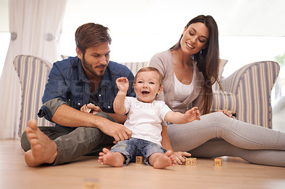Buy stock photo Parents, baby or building blocks on floor, love or growth or development toys for sensory play in living room. Happy family, kid or interactive game for child or bonding together with care in home