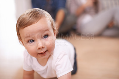Buy stock photo Young baby, crawling and portrait in family home, child and play on living room floor. Childhood development, growth and bonding or learning to move, mobility and education with support from parents