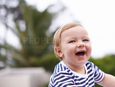 Buy stock photo Boy, baby and happy for curiosity in outdoors, joy and kid to relax by sky or nature. Child development, toddler and calm or comfortable, wellness and laugh on weekend for health and positive growth