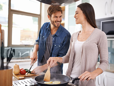 Buy stock photo Happy couple, food and cooking together in a pan in the kitchen with healthy organic ingredients for dinner at home. Man helping woman with smile in happiness making meal with vegetables on stove