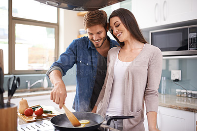 Buy stock photo Happy couple, cooking and lunch in pan in house, love and bonding together in marriage on weekend. Man, woman or wellness by healthy food in home, care or frying on kitchen stove for romantic dinner
