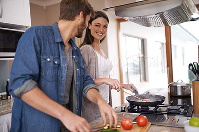 Buy stock photo Happy couple, cooking and cutting board with vegetables in kitchen, love and bonding together for lunch on weekend. Man, woman and marriage with healthy food in care and salad for romantic dinner