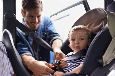 Buy stock photo Safety, car seat and belt with father with baby for transportation, security and drive. Travel, protection and caution with man fasten strap on toddler in vehicle for responsibility and road trip