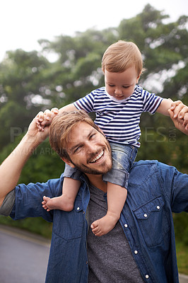 Buy stock photo Portrait, smile or father with toddler in outdoor, love or bonding together for child growth or development. Happy family, dad or kid on shoulders to play, face or responsibility for son on weekend