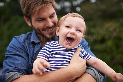 Buy stock photo Outdoor, tickling and father with baby in park, love and bonding together for child growth or development. Happy family, dad and holding son to play on holiday, wellness and relax in nature for fun