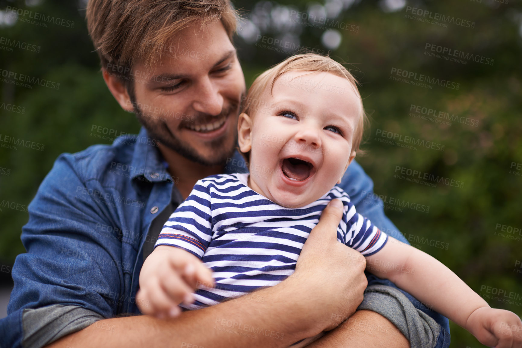 Buy stock photo Outdoor, tickling and father with baby in park, love and bonding together for child growth or development. Happy family, dad and holding son to play on holiday, wellness and relax in nature for fun