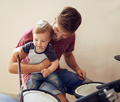 Buy stock photo Dad, baby and drummer teaching for music development and child learning. Home, father happiness and kid instrument together with youth lesson with a smile, love and parent care at a family house 