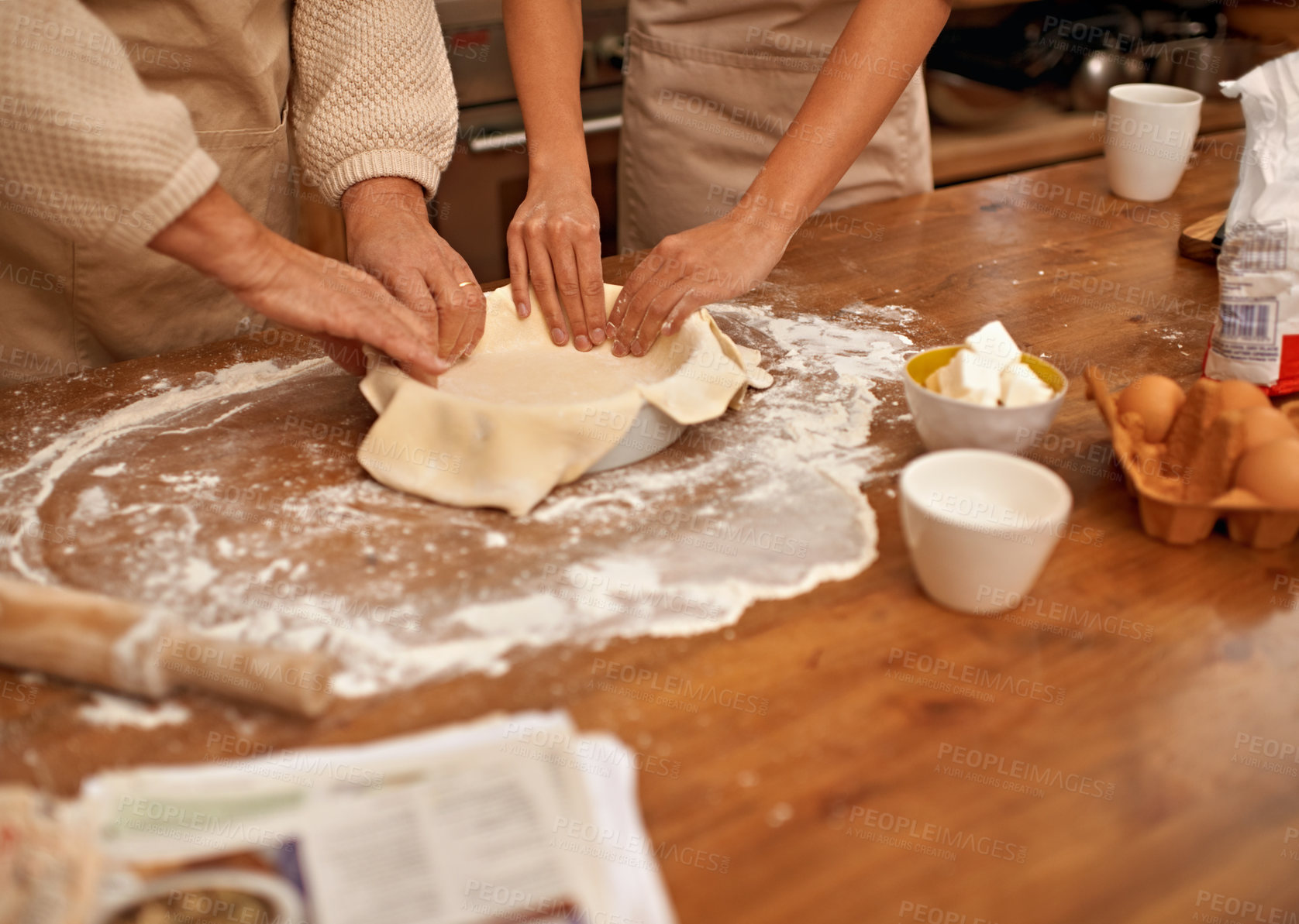 Buy stock photo Hands, food and couple baking in kitchen of home together closeup with ingredients for recipe. Cooking, dough or flour with husband and wife in apartment for fresh pastry preparation from above