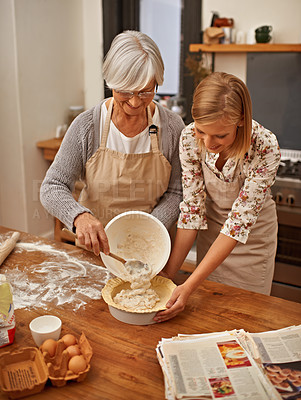 Buy stock photo Baking, food and senior mother with daughter in kitchen of home together for pastry preparation. Cake, dough or flower with parent and woman in apartment, cooking ingredients for family bonding