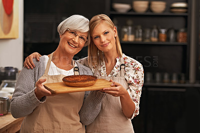 Buy stock photo Portrait, happy woman and elderly mother with pie in kitchen, cooking or smile of family showing homemade food together in house. Face, daughter or senior mom with dessert, pastry or help with baking