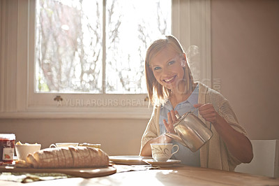 Buy stock photo Pouring, tea and portrait of woman in home with calm routine, morning and drink on table. Girl, relax and coffee break with food, bread or teapot for breakfast preparation on holiday or vacation