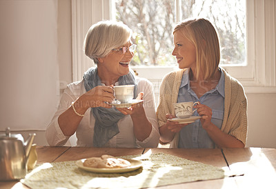 Buy stock photo House, senior and daughter together with tea for breakfast with biscuits, health and snacks with woman. Female person, smile and happiness with mother in family home, elderly and girl with coffee