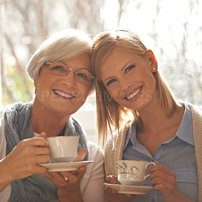Buy stock photo Portrait, smile and woman with senior mother drinking coffee at breakfast in the morning, bonding and happy in house. Face, elderly mom and daughter with tea cup, love and family at home together