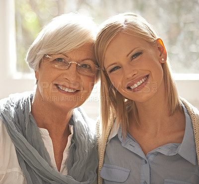 Buy stock photo Senior mother, daughter and happiness for bonding in portrait at nursing home for visit and conversation with love. Mature woman, lady and together with affection or care, family and embrace with hug
