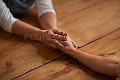 Buy stock photo A cropped view of a woman holding a friend's hand in support