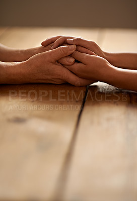 Buy stock photo Love, support and closeup of people holding hands for grief, hope and sympathy after loss. Gratitude, empathy and couple having intimate moment with affection for unity, trust and solidarity on table
