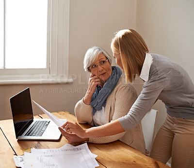 Buy stock photo Senior woman, daughter and laptop with bills, finance and technology with advice and assistance. Help with online payment, budget with life insurance or conversation on tax paperwork in retirement