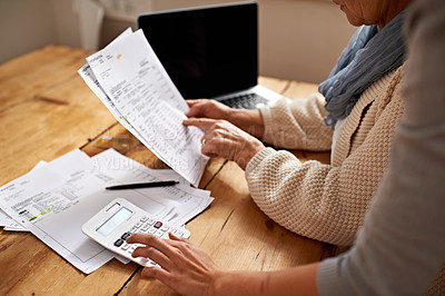Buy stock photo Cropped view of a senior woman receiving help with her finances from her granddaughter