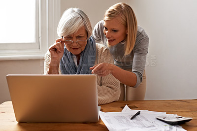 Buy stock photo Granddaughter, grandmother and help with laptop for online payment, finance and technology with advice on budget. Women pay bills, life insurance or tax paperwork with retirement and assistance