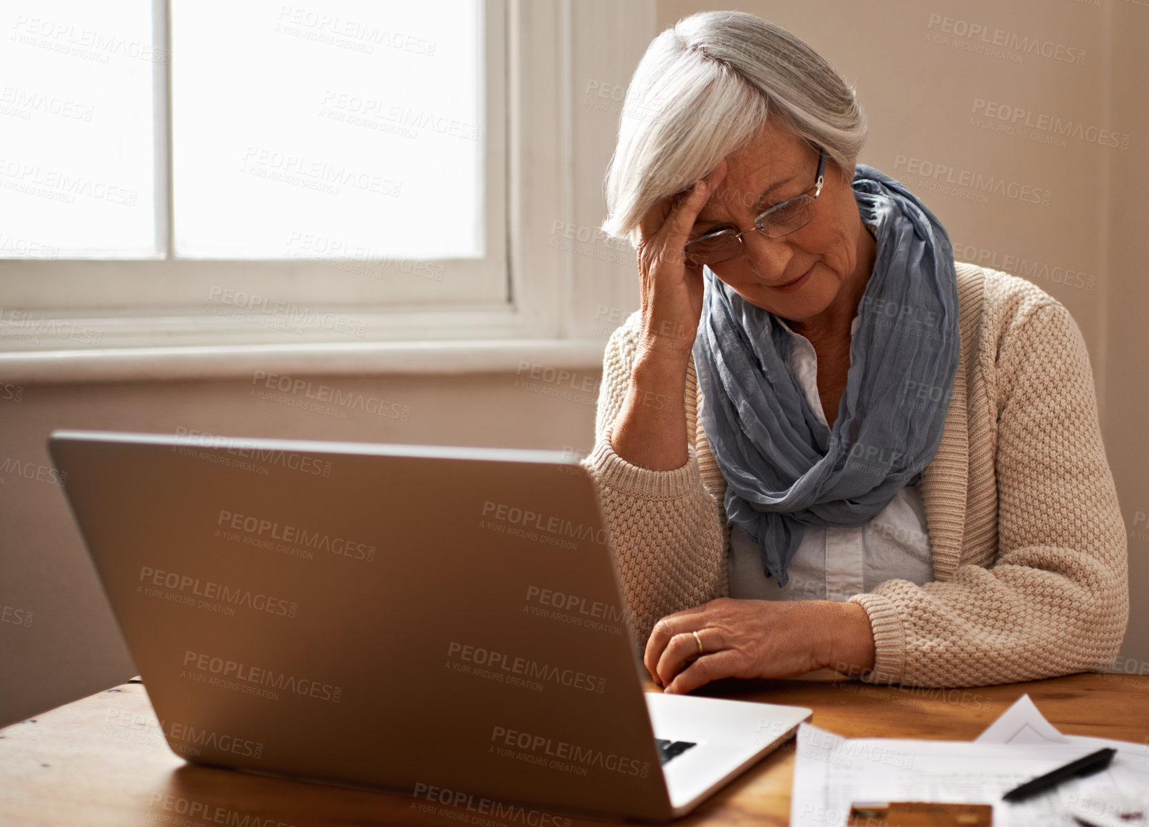 Buy stock photo Senior woman, stress and laptop for finance in home, worry and paperwork for tax return or insurance. Elderly female person, frustrated and documents for retirement plan, fail and mistake in budget