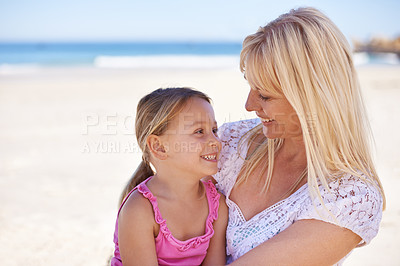 Buy stock photo Love, hug or mother and daughter at beach with support, safety and trust while bonding in nature. Travel, care and mom embrace girl child at the ocean for fun, adventure or summer holiday in Bali