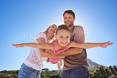Buy stock photo Happy family, beach and flying with child for fun summer, holiday or outdoor weekend together in nature. Mother, father and little girl playing for freedom in the sun by the ocean coast with blue sky