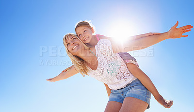 Buy stock photo Shot of a mother playing with her young daughter in the outdoors