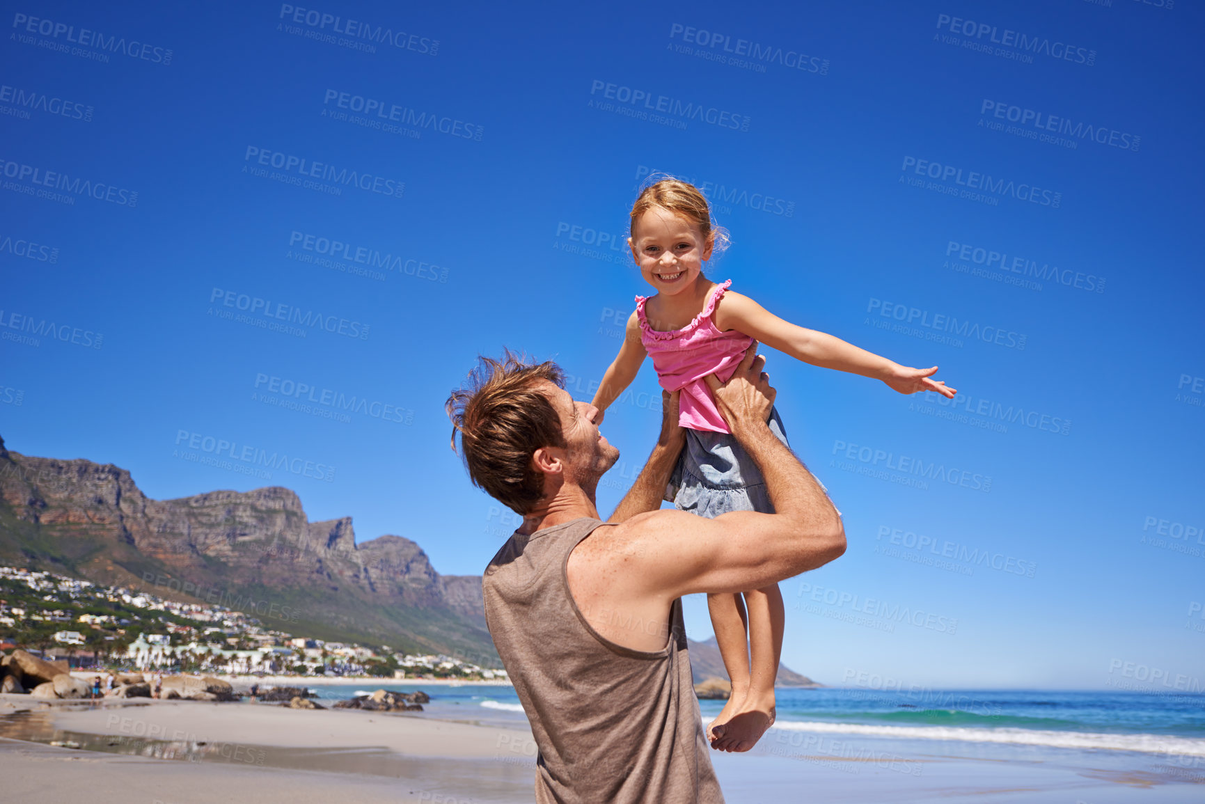 Buy stock photo Love, airplane and father lifting child at a beach for travel, fun or bonding in nature together. Freedom, support and dad embrace girl at sea for morning games, playing or adventure in South Africa