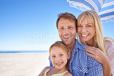 Buy stock photo Portrait, smile and family at beach with umbrella, mockup space and tropical holiday adventure together. Happy mother, father and daughter on ocean vacation with blue sky, sunshine and island at sea