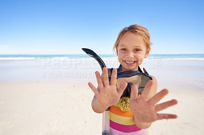 Buy stock photo Girl, portrait and hands for goggles at beach, swimming and equipment for snorkeling on holiday. Female person, child and happy on tropical vacation in outdoors, sand and blue sky for mockup space
