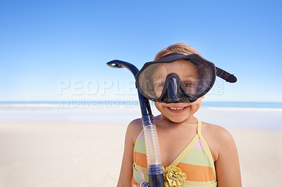 Buy stock photo Girl, portrait and goggles for snorkeling at beach, smile and equipment for swimming on holiday. Female person, child and travel on tropical vacation in outdoors, sand and blue sky for mockup space