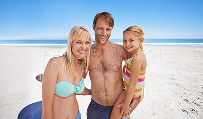 Buy stock photo Love, portrait and happy family at a beach with support, security and bonding in swimwear in nature. Travel, freedom and kid with parents at sea for swimming, adventure and summer fun in Maldives