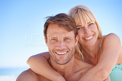 Buy stock photo Love, portrait and happy couple hug at a beach with support, gratitude and bonding in nature together. Travel, face and people embrace at the ocean for adventure, romance and summer, fun or holiday