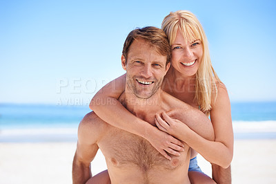 Buy stock photo Portrait, piggyback and happy couple hug at a beach with support, gratitude and bonding in nature together. Travel, love and people embrace at sea for adventure, romance and summer, fun or holiday