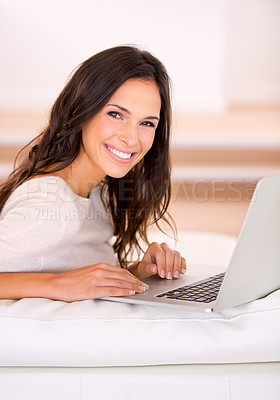Buy stock photo Woman, laptop and happy on sofa for portrait with remote work from home, living room or freelance editing. Person, writer and smile with pc on couch for typing, creativity and article in Barcelona