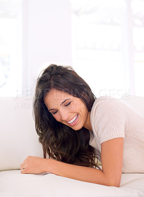 Buy stock photo Portrait, laughing or happy woman on couch to relax in living room on holiday in a house or apartment. Lying down, sofa or funny person with smile or wellness on vacation break to rest in alone time