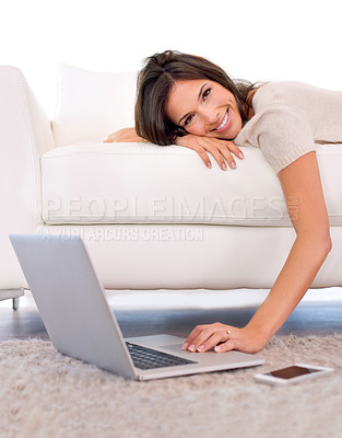Buy stock photo Woman, portrait and relax on sofa with laptop on floor for scroll, search or streaming in home living room. Girl, person and lying on couch with computer on carpet for movies, show or happy in house