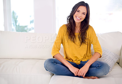 Buy stock photo Woman, happy and sitting in portrait on sofa to relax in home with pride, holiday and confidence in living room. Person, smile and break on vacation in lounge with couch at apartment in Barcelona