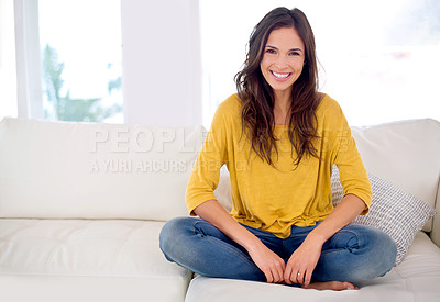 Buy stock photo Cropped portrait of a beautiful young woman relaxing at home