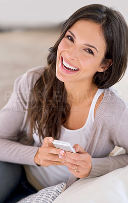 Buy stock photo Cropped portrait of a beautiful young woman relaxing at home