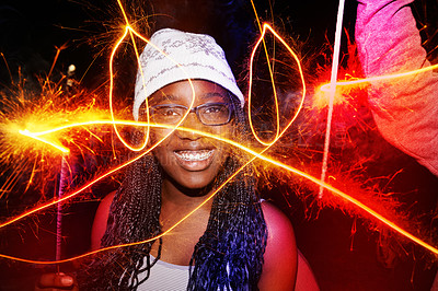Buy stock photo Cropped shot of a teenage girl playing with sparklers