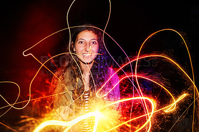 Buy stock photo Portrait, teenager and girl for playing with fireworks, bright and celebration with neon color lights at night. Young woman, happy and face by sparklers for patterns and party on holiday or new year