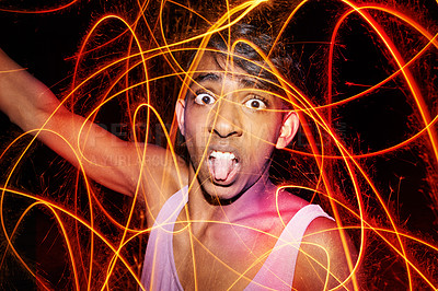 Buy stock photo Portrait, fireworks and funny with teenage boy, celebration and fun with vacation and excited. Face, Indian person or weekend party with guy fawks or event for New Year with culture, silly or holiday