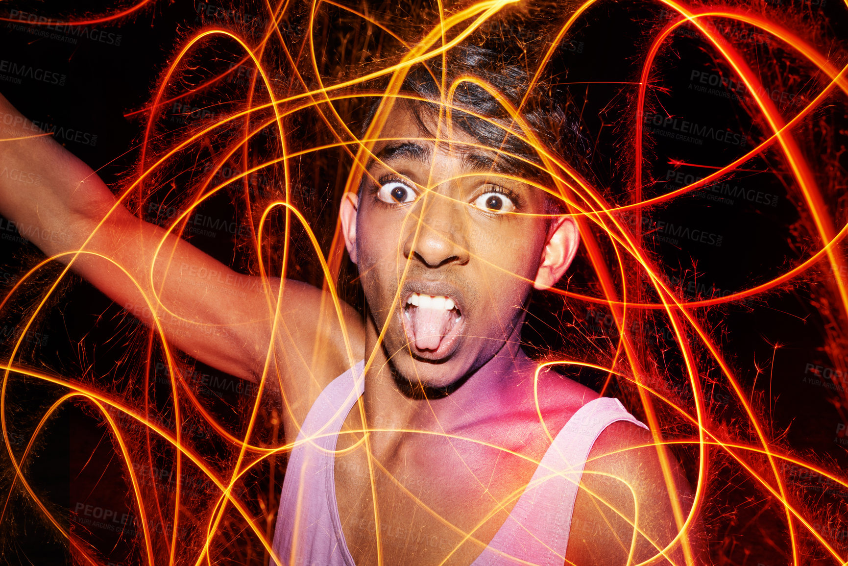 Buy stock photo Portrait, fireworks and funny with teenage boy, celebration and fun with vacation and excited. Face, Indian person or weekend party with guy fawks or event for New Year with culture, silly or holiday