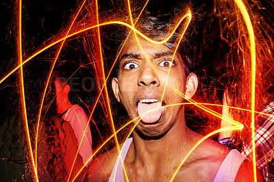 Buy stock photo Fireworks, light and portrait of man for festival, party and new years eve celebration at night. Happy, crazy face and person with sparkle pattern for festive vacation, holiday and birthday event