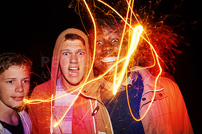Buy stock photo Fireworks, night and portrait of friends for festival, party and new years eve celebration at night. Lights, excited and face of men with sparkles for festive vacation, holiday and event together