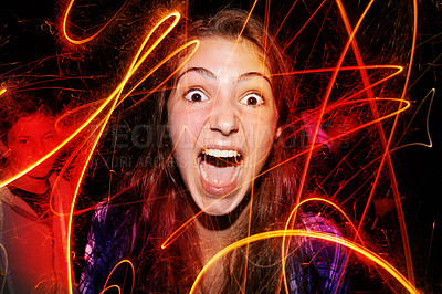 Buy stock photo Portrait, fireworks and playing with girl, excited and celebration with weekend break and funny. Face, person and pattern with sparklers and event for New Year with culture and holiday with fun