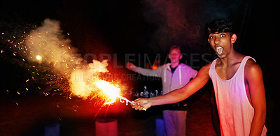 Buy stock photo Portrait, night and man at festival with fireworks for Diwali, New Year or social event in India. Celebration, sparkle lights and excited friends with fire art, smoke or flare for happy outdoor party