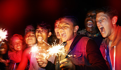 Buy stock photo Group, teens and excited with fireworks, vacation and funny with happiness and shouting with weekend break. Friends, outdoor or people with sparklers or holiday with party or screaming with New Years